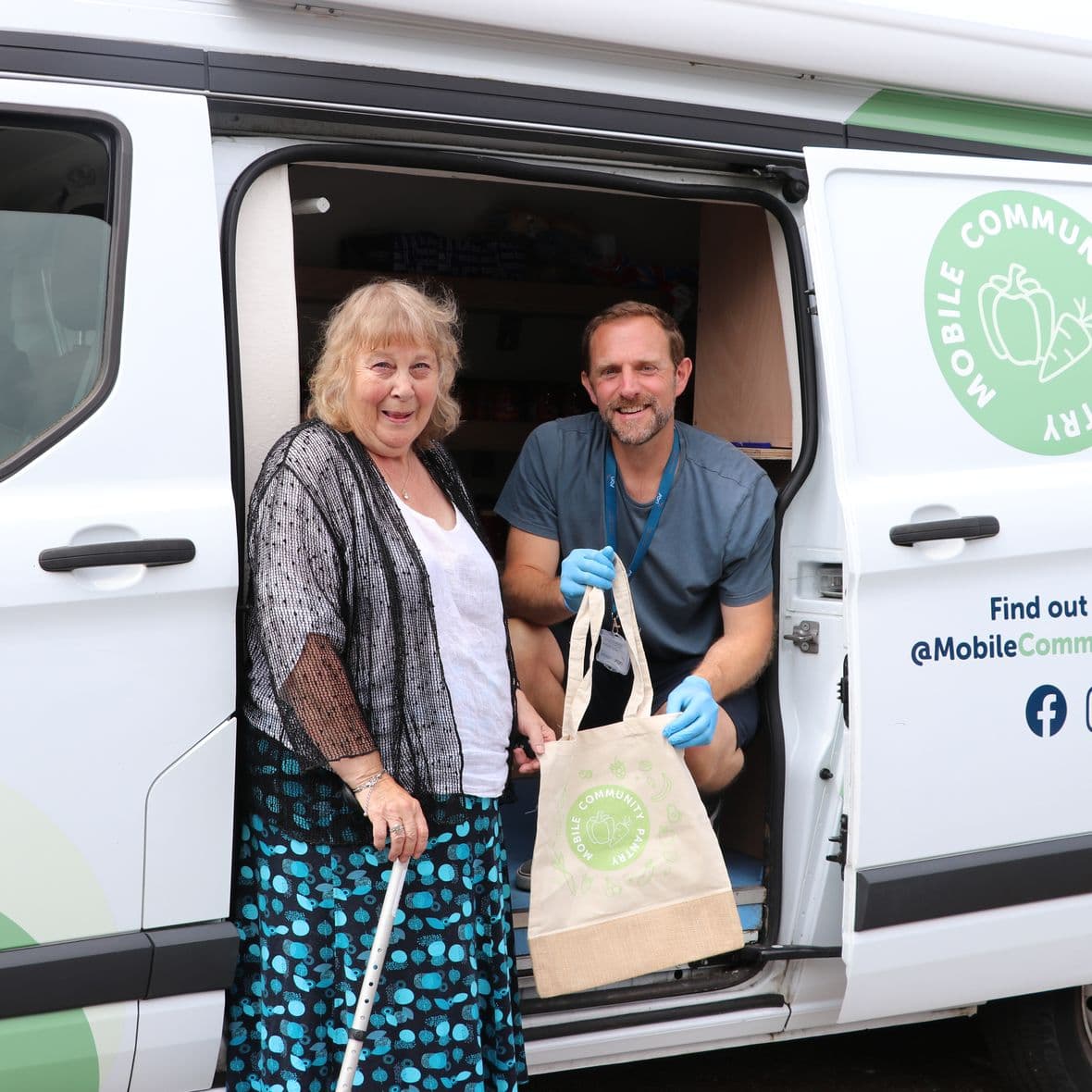 Bobby Tait with mobile community pantry customer