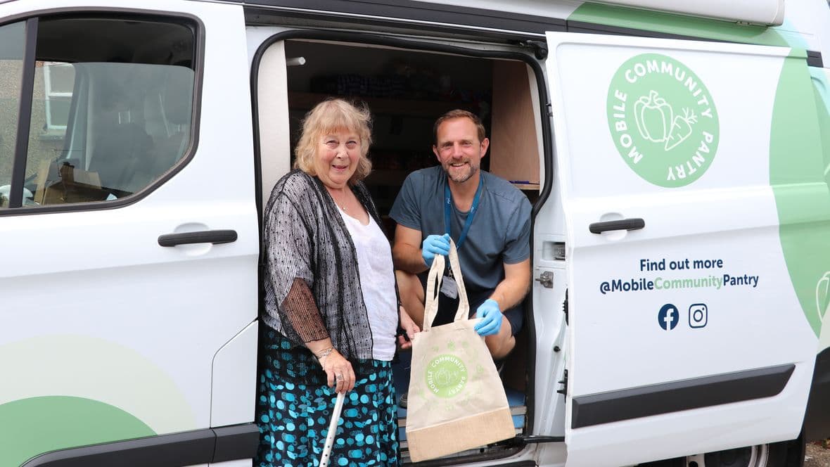 Bobby Tait with mobile community pantry customer